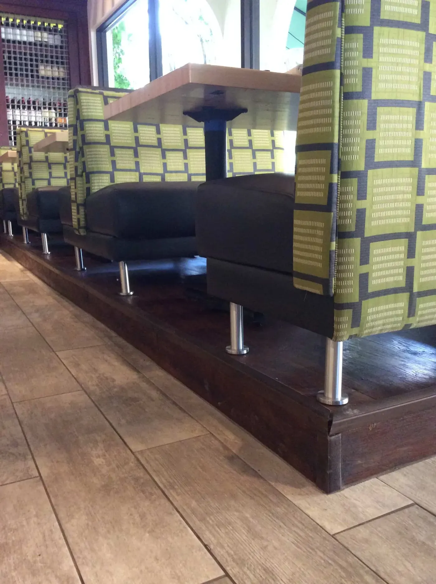 Restaurant booths with patterned upholstered backs