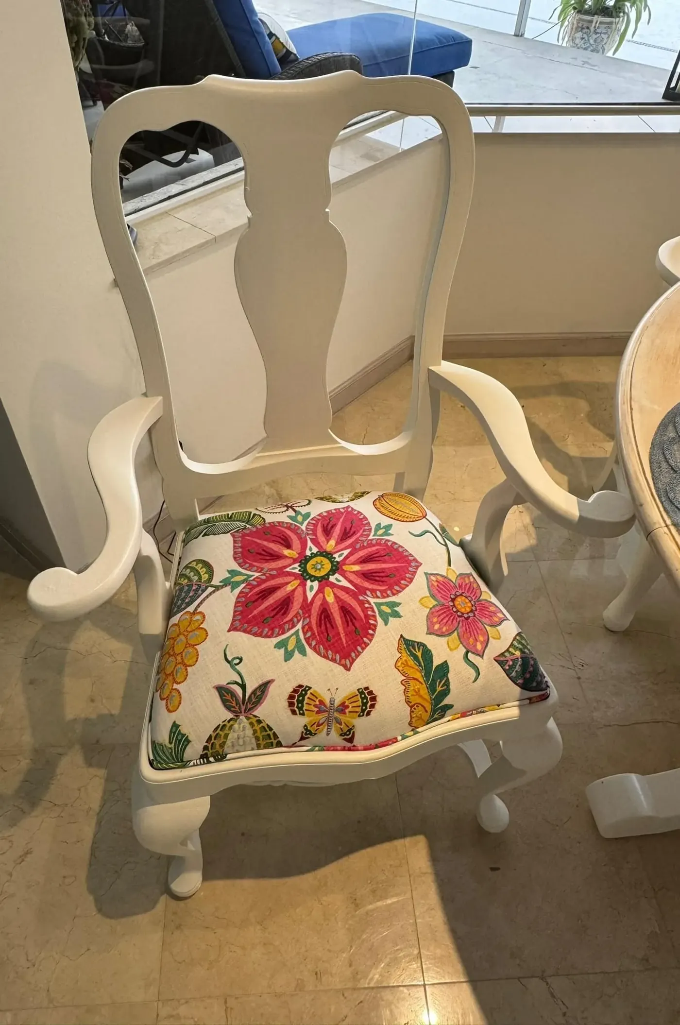 White dining chair reupholstered in floral fabric