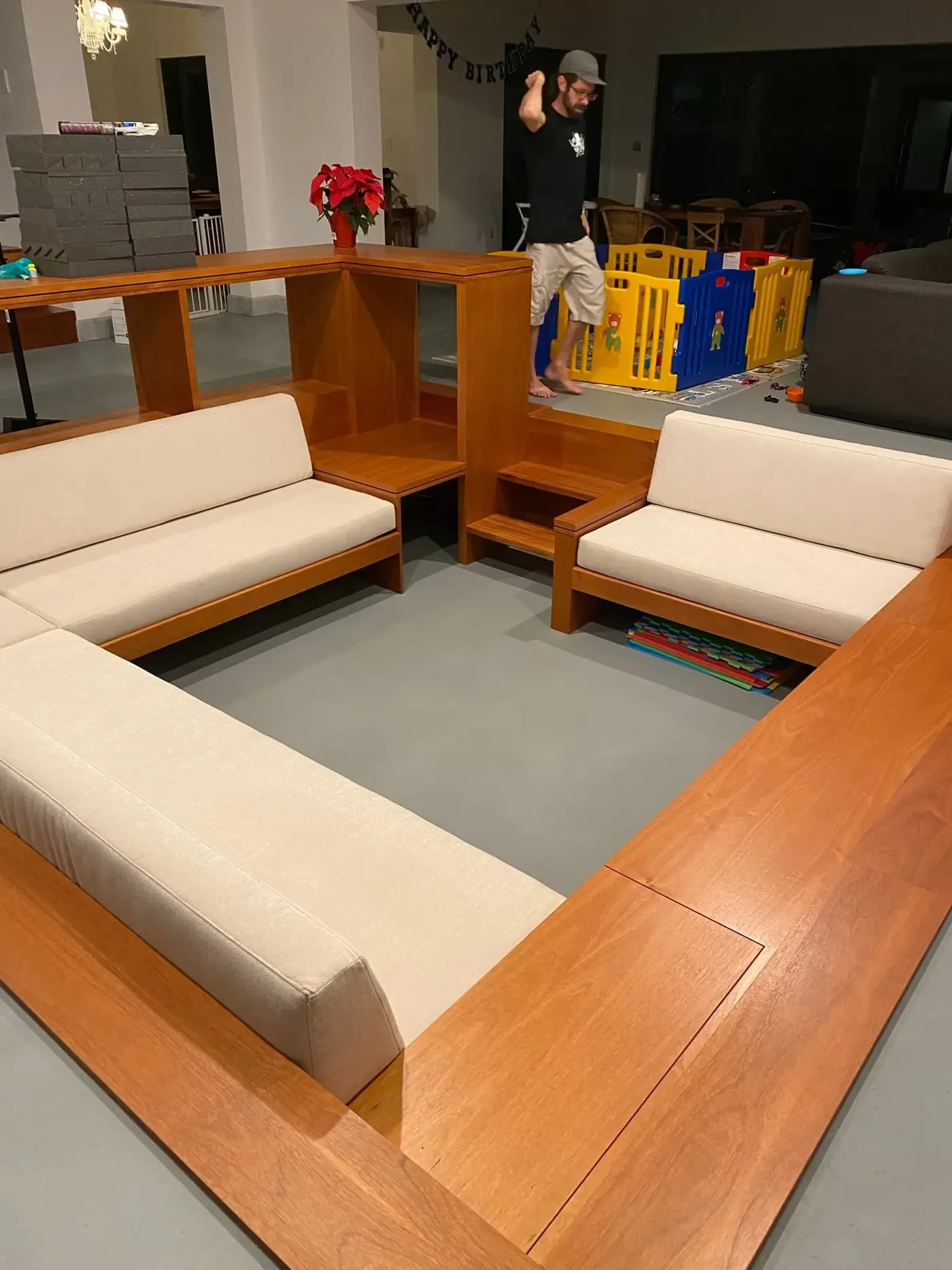 Wood-frame lounge seating with custom cushions in a commercial space