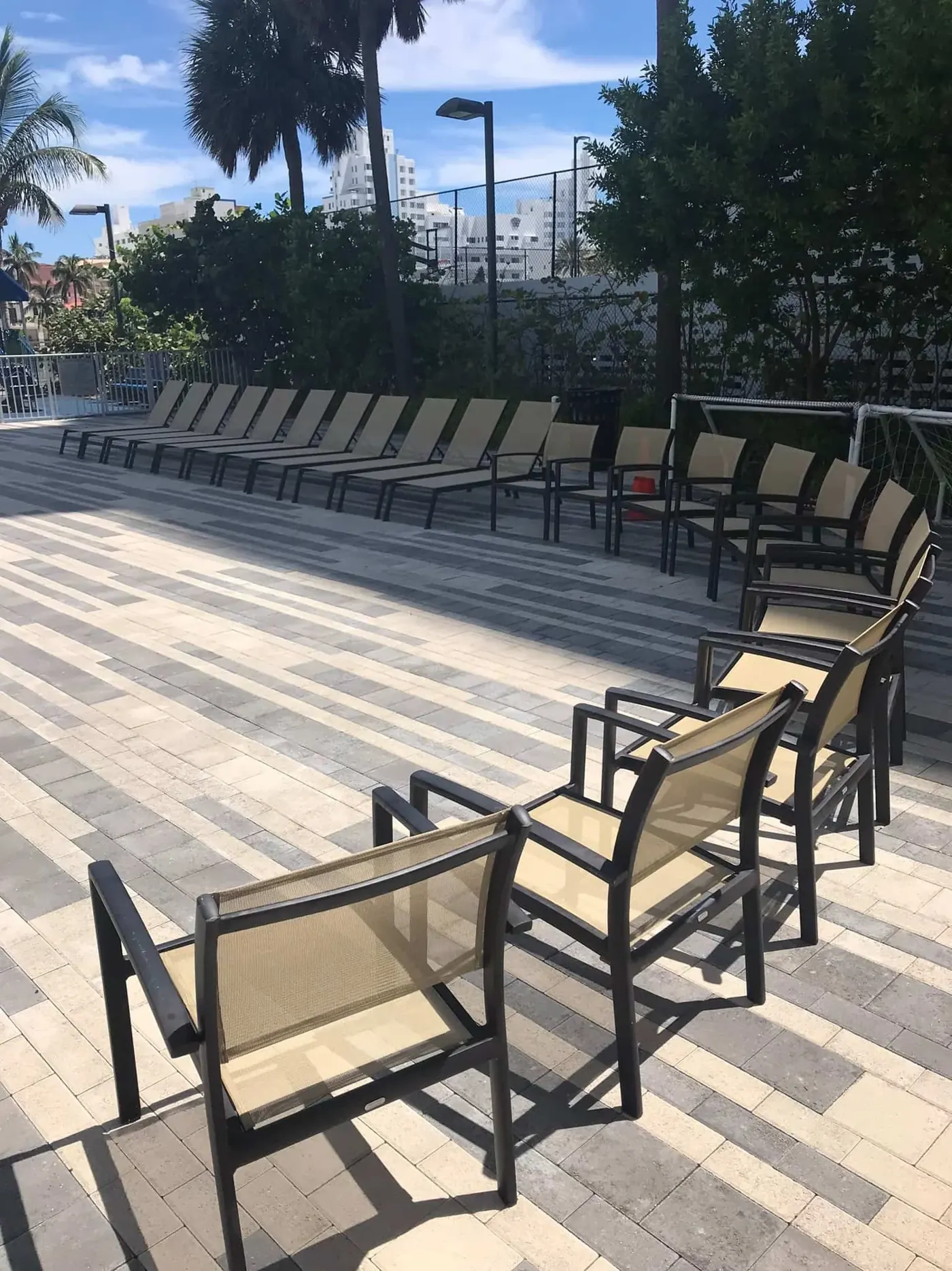 Pool deck lounge chairs for a residential tower