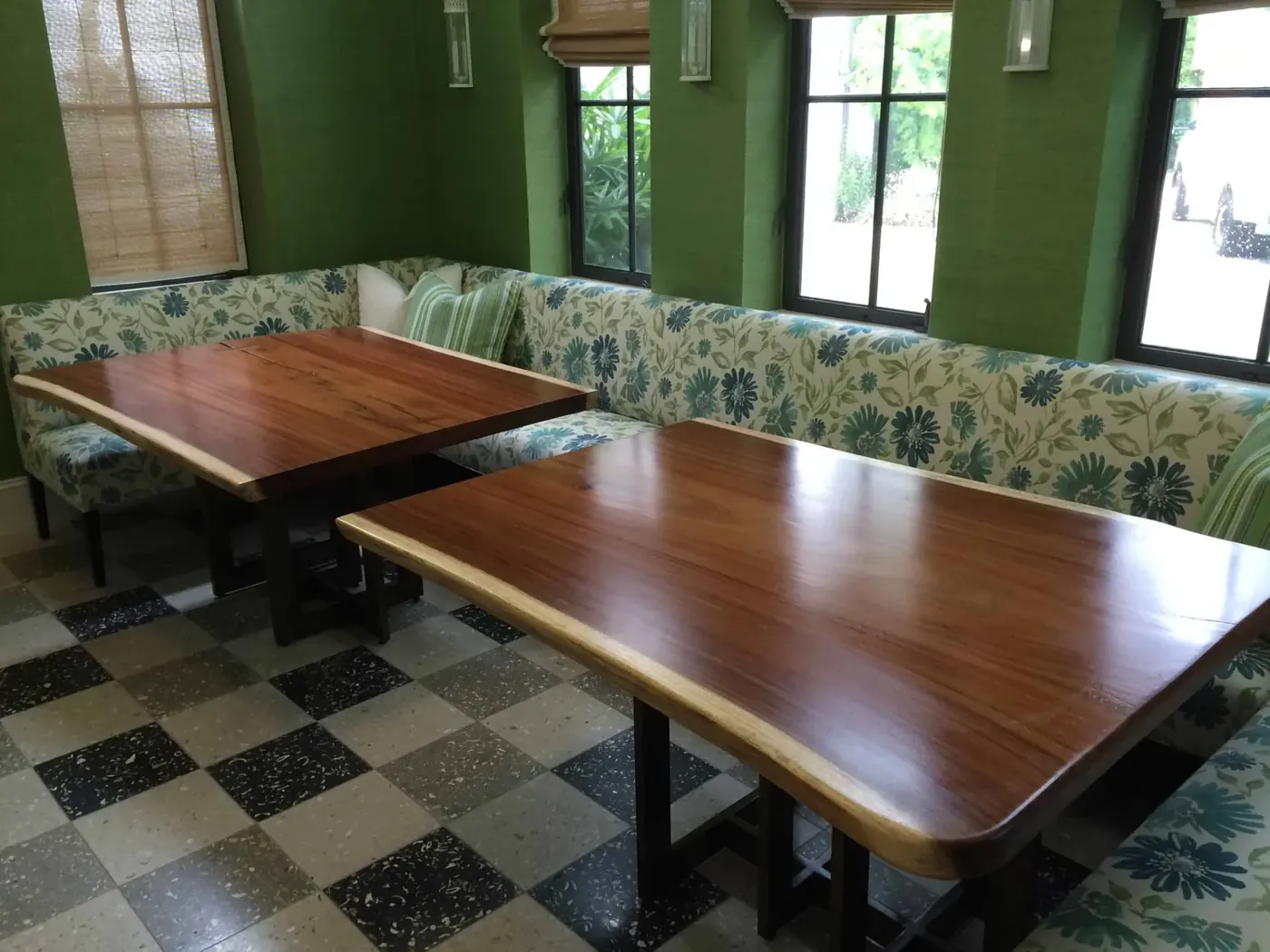 Refinished dining tables with upholstered banquette