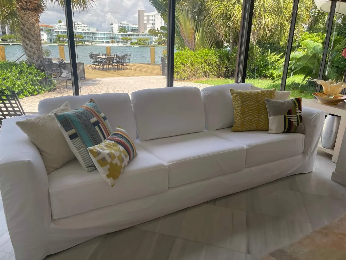 White sofa reupholstered for a waterfront living room